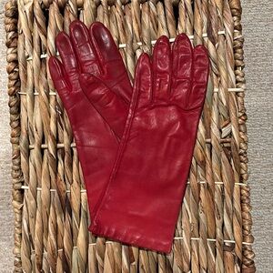 Red leather driving gloves.